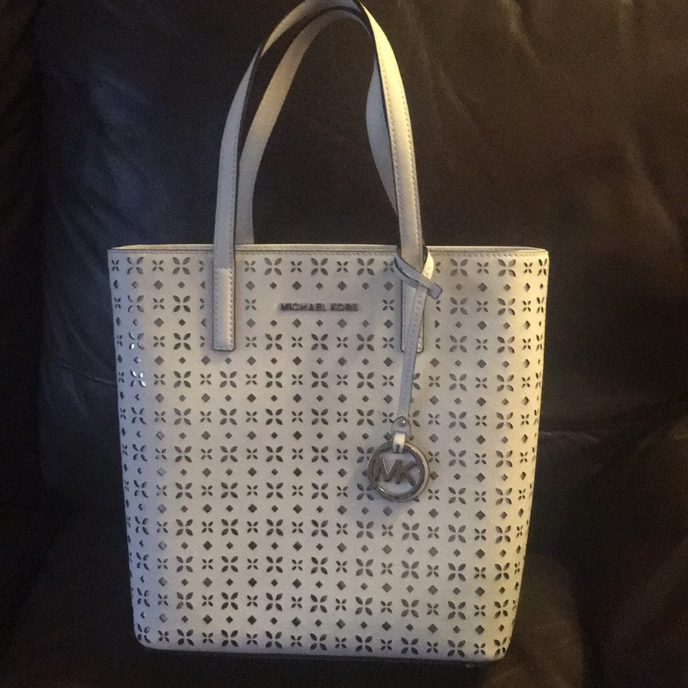 Michael Kora white cutout bucket bag